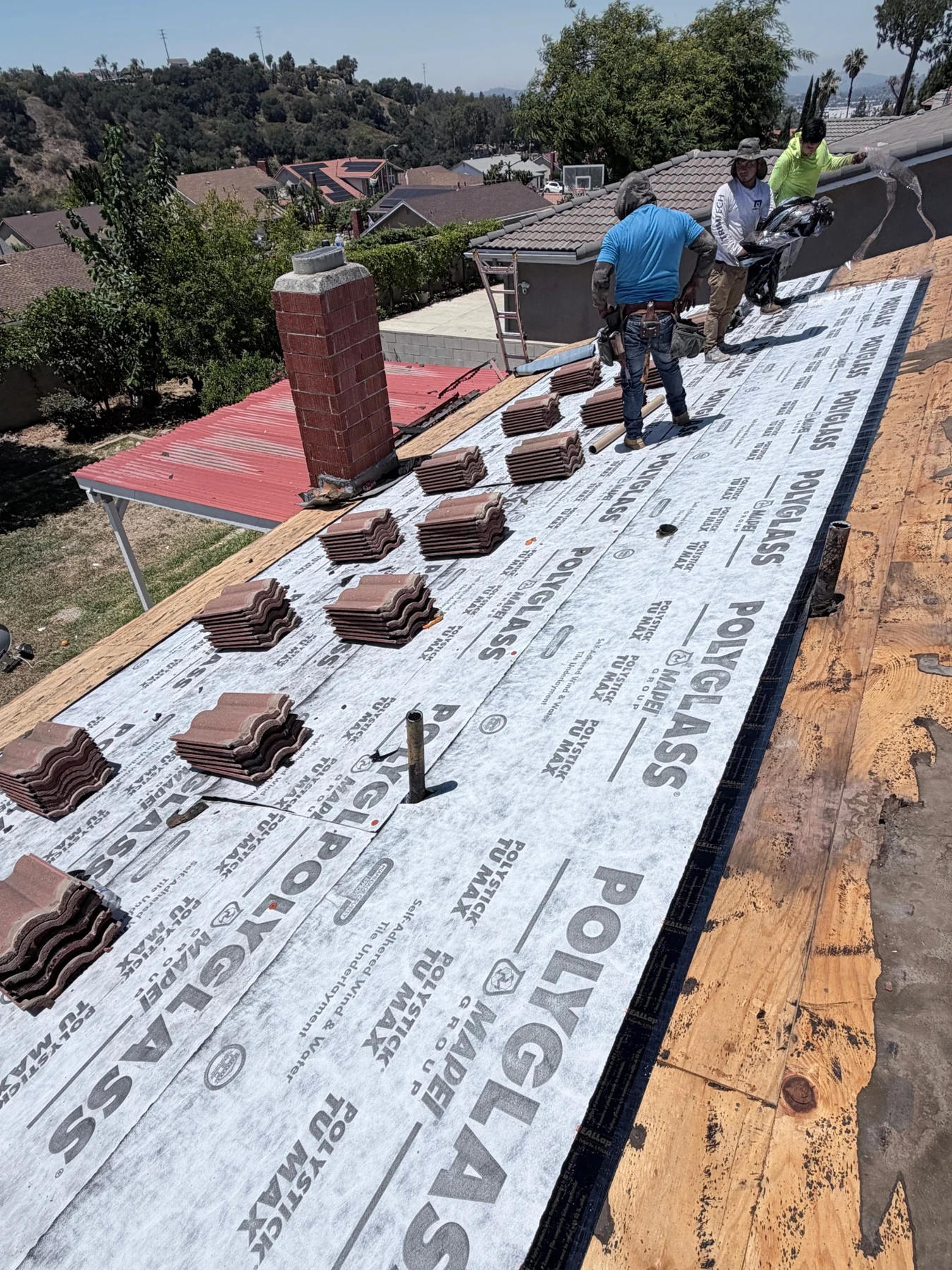 Tile roof replacement in progress